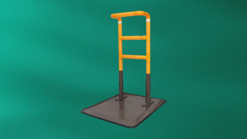 Movable bedside armrest-